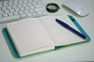 Open notebook and pen on a work desk for daily planning