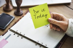 Sticky note reading do it today on a daily planner