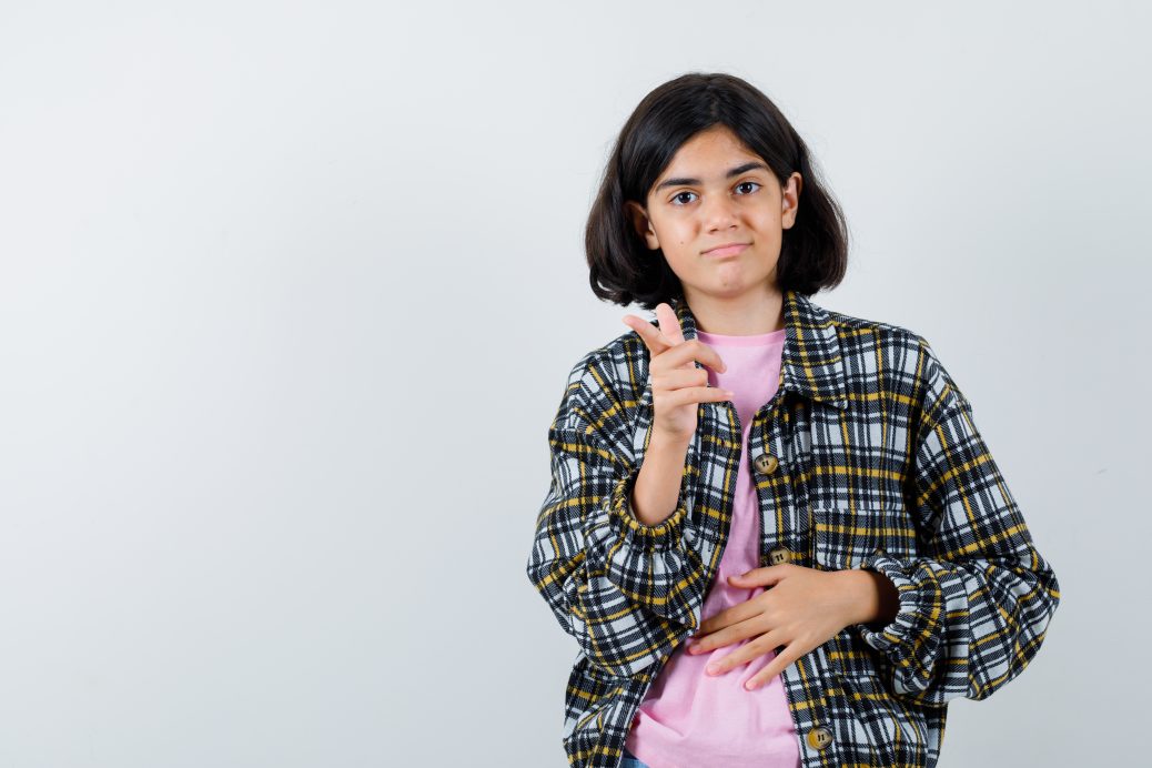 Teen girl pointing at the camera to highlight PCOS in teens