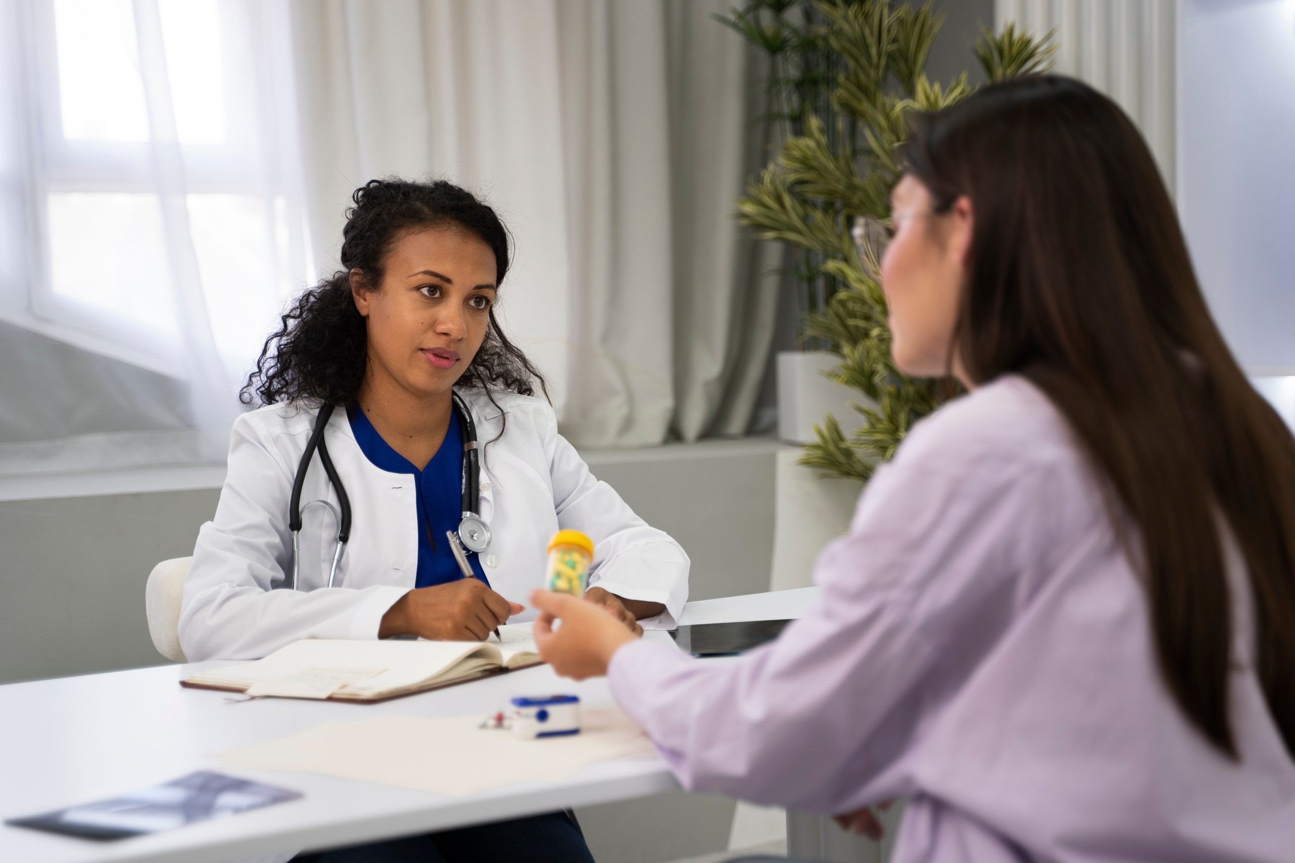 Indian Doctor Reviewing PCOS Medicine and Lab Tests Indian female doctor discussing PCOS medicine, lab tests, and diagnosis with a patient in a clinic.